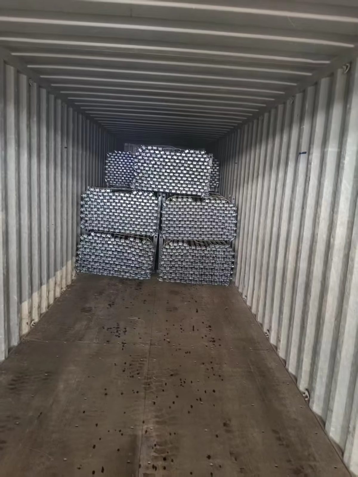 Ringlock scaffolding components bundled and loaded into export container