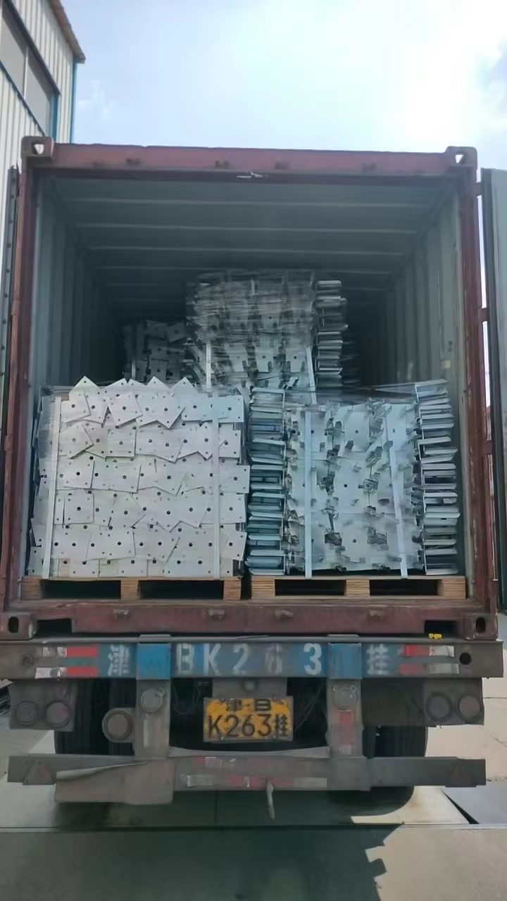 Galvanized scaffold components on pallets loaded on trailer for container shipping